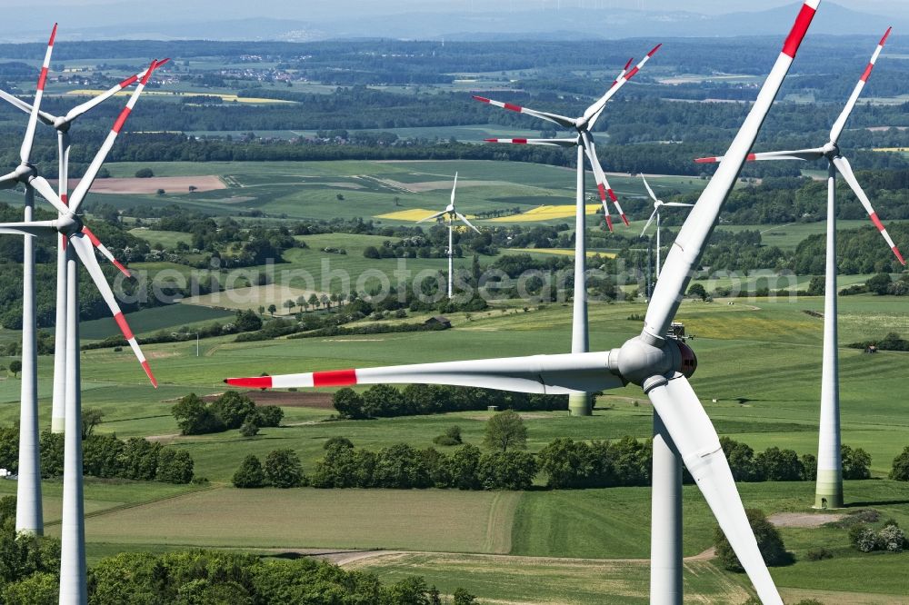 Feldatal from the bird's eye view: Wind turbine windmills (WEA) in a forest area in Feldatal in the state Hesse, Germany