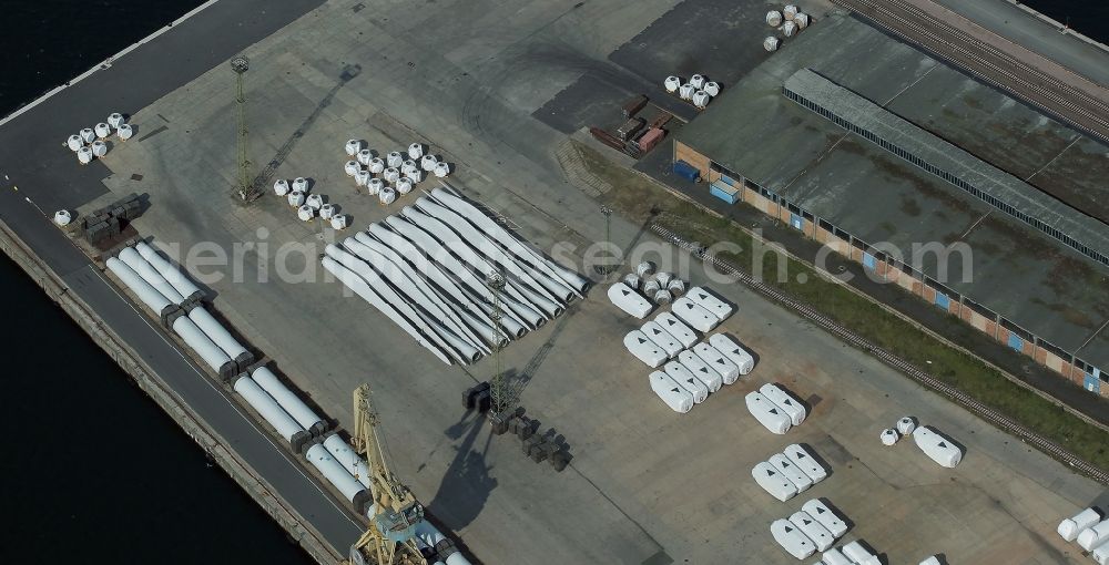 Aerial image Rostock - Wind turbine parts in the port in Rostock in the state Mecklenburg - Western Pomerania