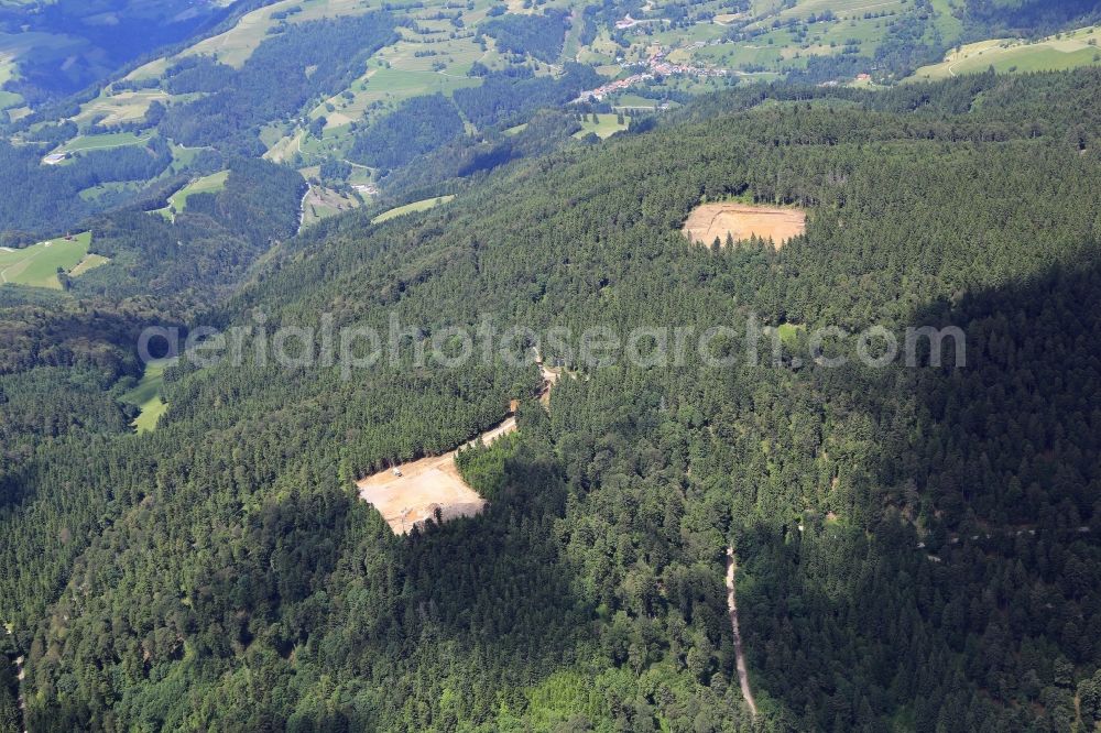 Aerial photograph Schopfheim - On the Rohrenkopf, the local mountain of Gersbach, a district of Schopfheim in Baden-Wuerttemberg, wind turbines are built. The building areas for the wind turbines have already been cleared in the forest landscape anc construction works for the baseplate have startet