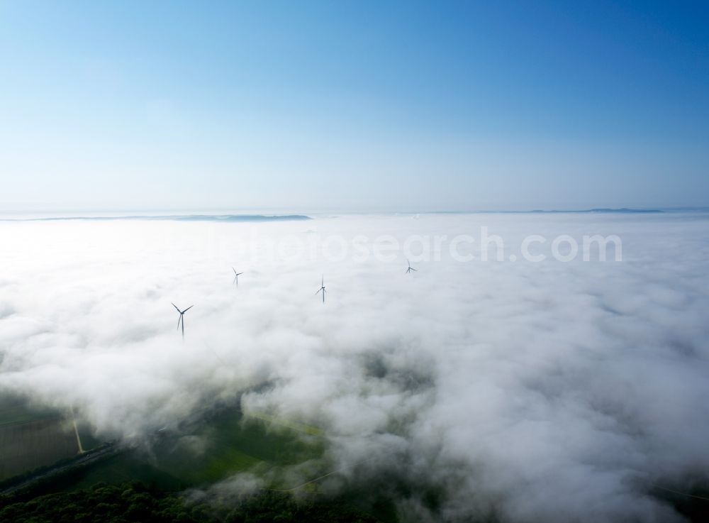 Biebelried from above - High fog-like cloud layers imposed by the source view of a wind turbine for electricity generation in Biebelried in Bavaria