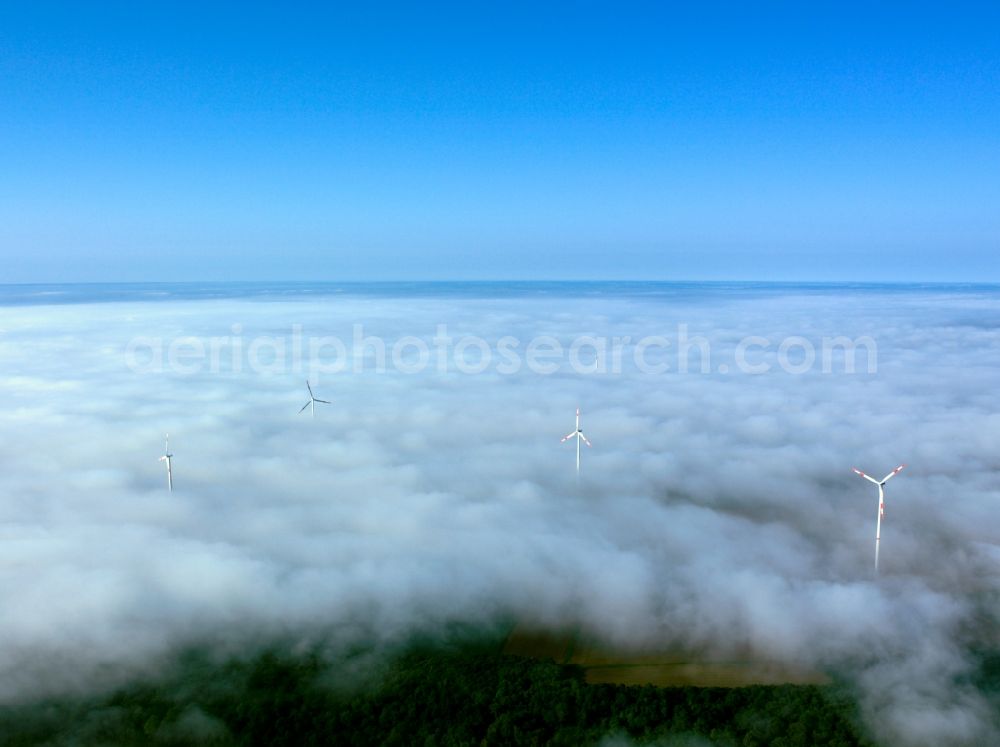 Biebelried from the bird's eye view: High fog-like cloud layers imposed by the source view of a wind turbine for electricity generation in Biebelried in Bavaria