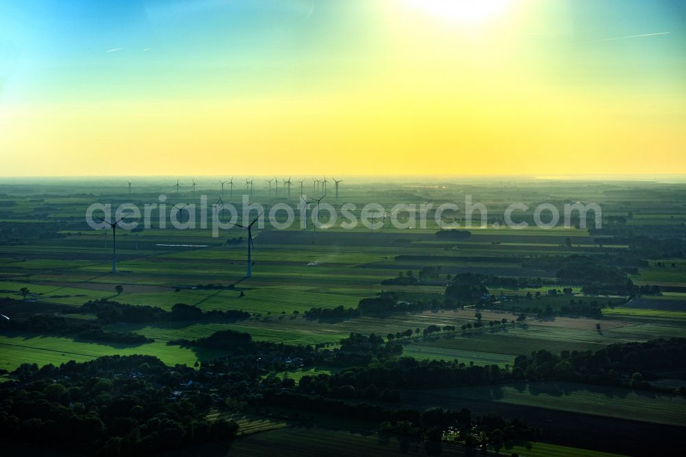 Krummendeich from above - Agricultural land and fields with wind turbines in Krummendeich in the state Lower Saxony, Germany