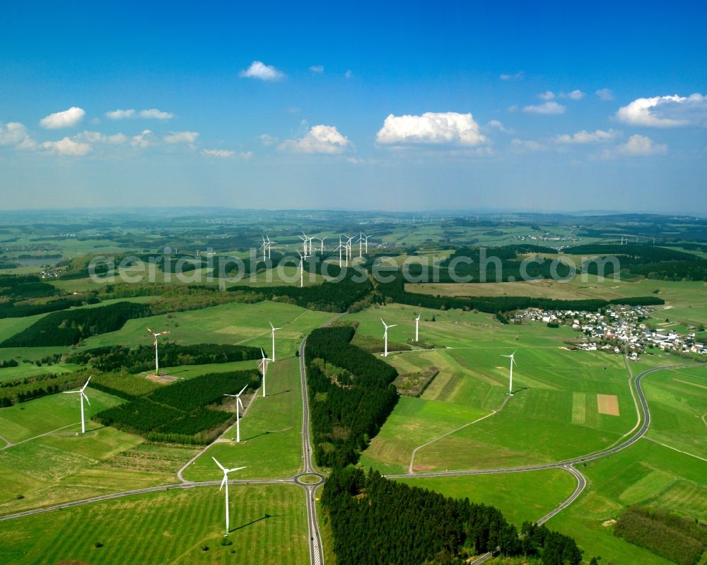 Dillenburg from the bird's eye view: Wind engines and turbines near Dillenburg in the county district of Lahn-Dill in the state of Hessen. The big wheels are located in the Dill valley, which is enclosed by the Westerwald forest and the Schwelder forest. Overview of these landscapes and the strategic placing of the turbines for energy generation