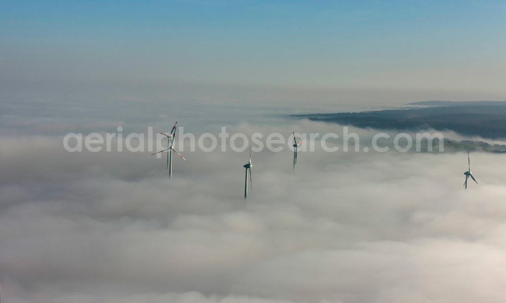 Bretleben from above - Windkrafträder bei Herbstwetter in einer Hochnebel - Wolkendecke bei Bretleben in Thüringen. Wind turbines in the autumn weather in a high fog - cloud cover at Bretleben in Thuringia.