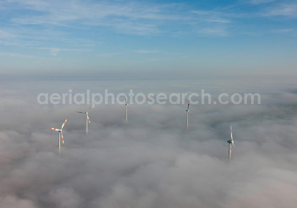 Aerial image Bretleben - Windkrafträder bei Herbstwetter in einer Hochnebel - Wolkendecke bei Bretleben in Thüringen. Wind turbines in the autumn weather in a high fog - cloud cover at Bretleben in Thuringia.