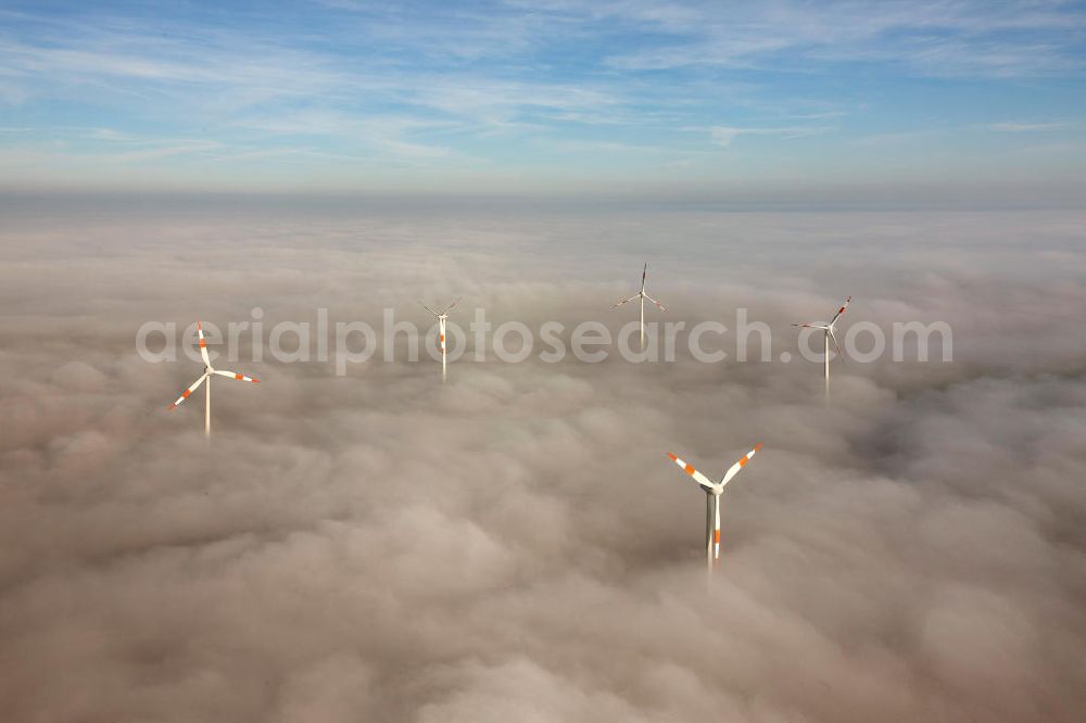 Aerial image Bretleben - Windkrafträder bei Herbstwetter in einer Hochnebel - Wolkendecke bei Bretleben in Thüringen. Wind turbines in the autumn weather in a high fog - cloud cover at Bretleben in Thuringia.