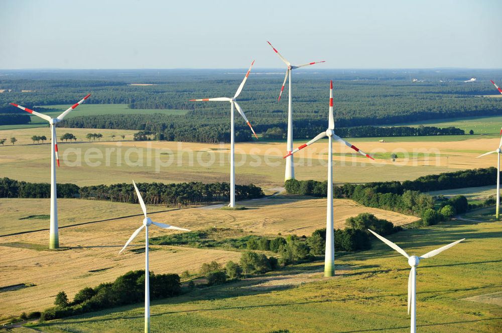 Woltersdorf from the bird's eye view: 06/27/2011 WOLTERSDORF view wind turbines of a wind power plant on the harvested fields at Woltersdorf in Saxony-Anhalt