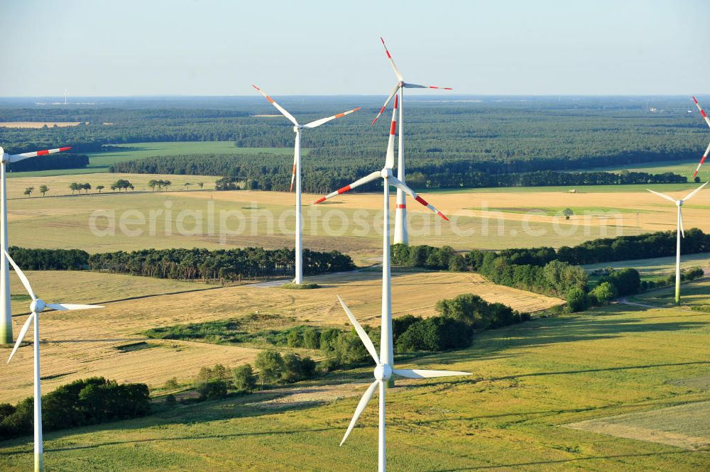 Woltersdorf from the bird's eye view: 06/27/2011 WOLTERSDORF view wind turbines of a wind power plant on the harvested fields at Woltersdorf in Saxony-Anhalt