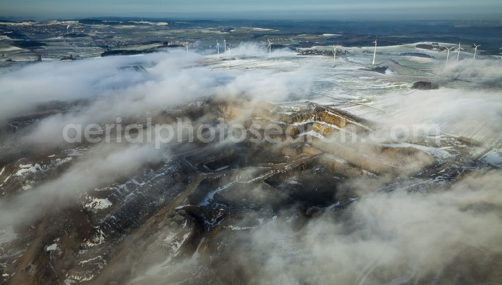 Aerial image Brilon - Wind power plants in Roesenbeck in wintry landscape verscheneiter in North Rhine-Westphalia, Germany