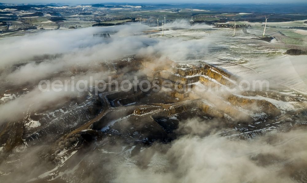 Aerial photograph Brilon - Wind power plants in Roesenbeck in wintry landscape verscheneiter in North Rhine-Westphalia, Germany