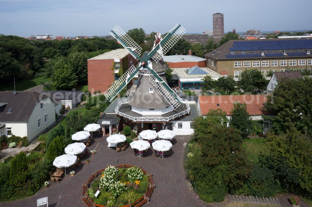 Norderney from the bird's eye view: Wind Mill Restaurant Zur Muehle Selden Ruest and cooperative comprehensive school in Norderney in Lower Saxony