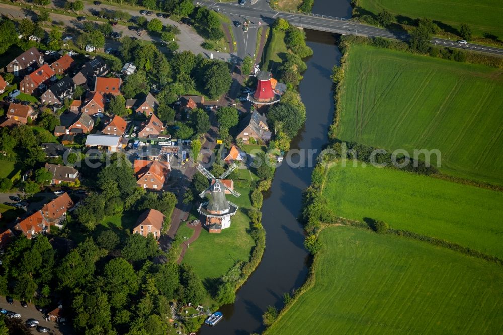 Greetsiel from above - Historic windmills Am Alten Greetsieler Sieltief in Greetsiel in the state Lower Saxony, Germany