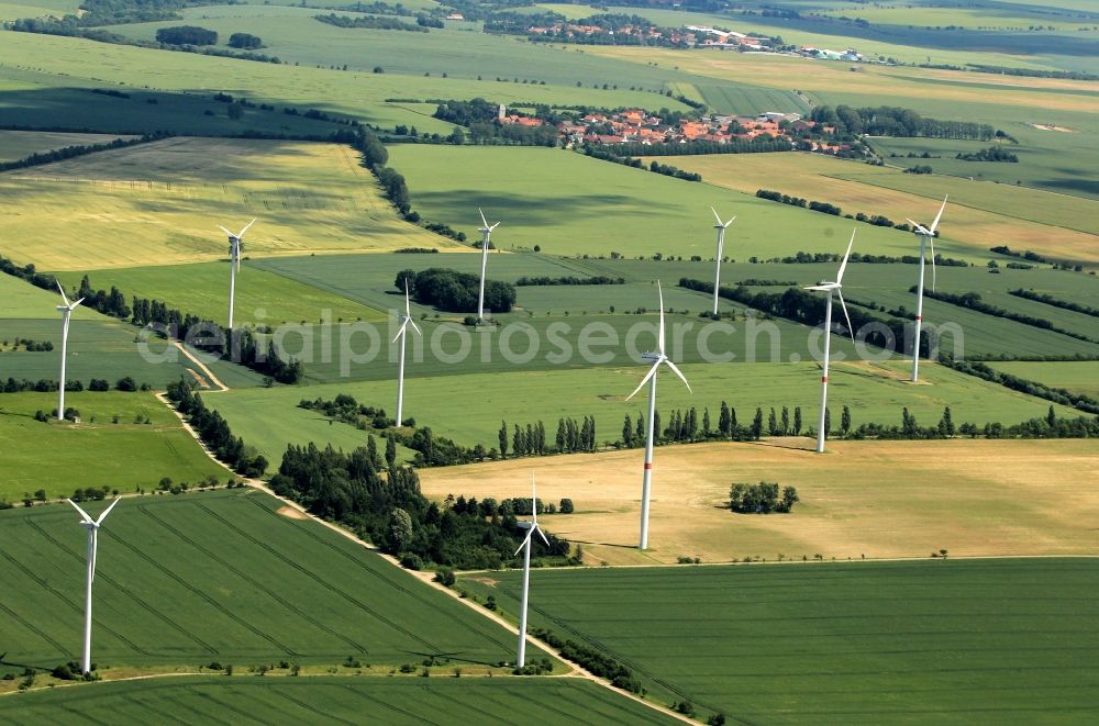 Aerial photograph Großenehrich - North of the places Kirchengel and Westerengel in Thuringia is operated by the Volkswind GmbH the wind farm Großenehrich. The Vestas Wind Farm consists of 11 Vestas V80 wind turbines that produce 22 megawatts. In the background is the place to see wooden angel with his Holy Trinity Church