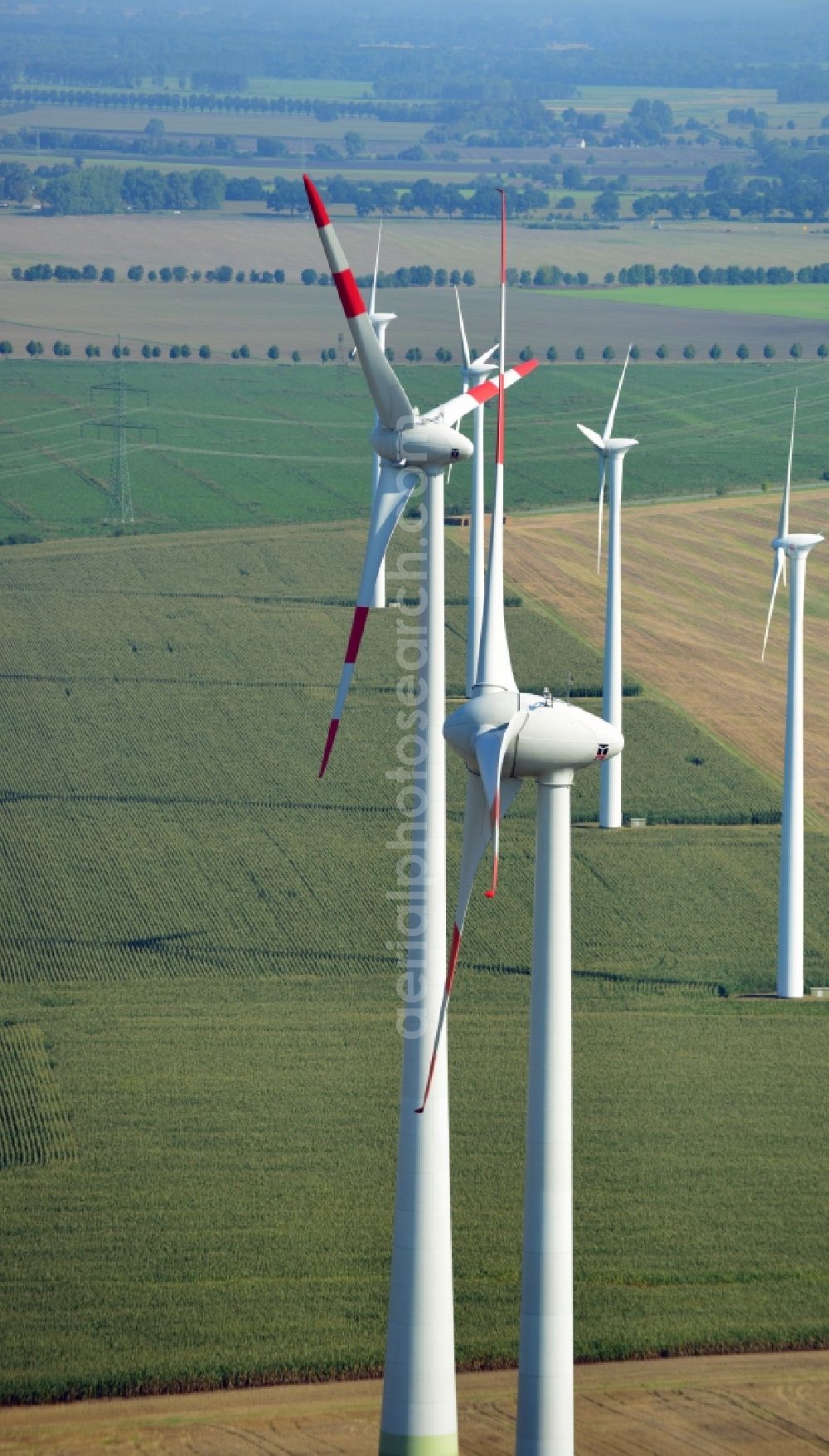 Nauen from the bird's eye view: View of the wind farm Nauen, a wind turbine field to plate the Nauen in Brandenburg