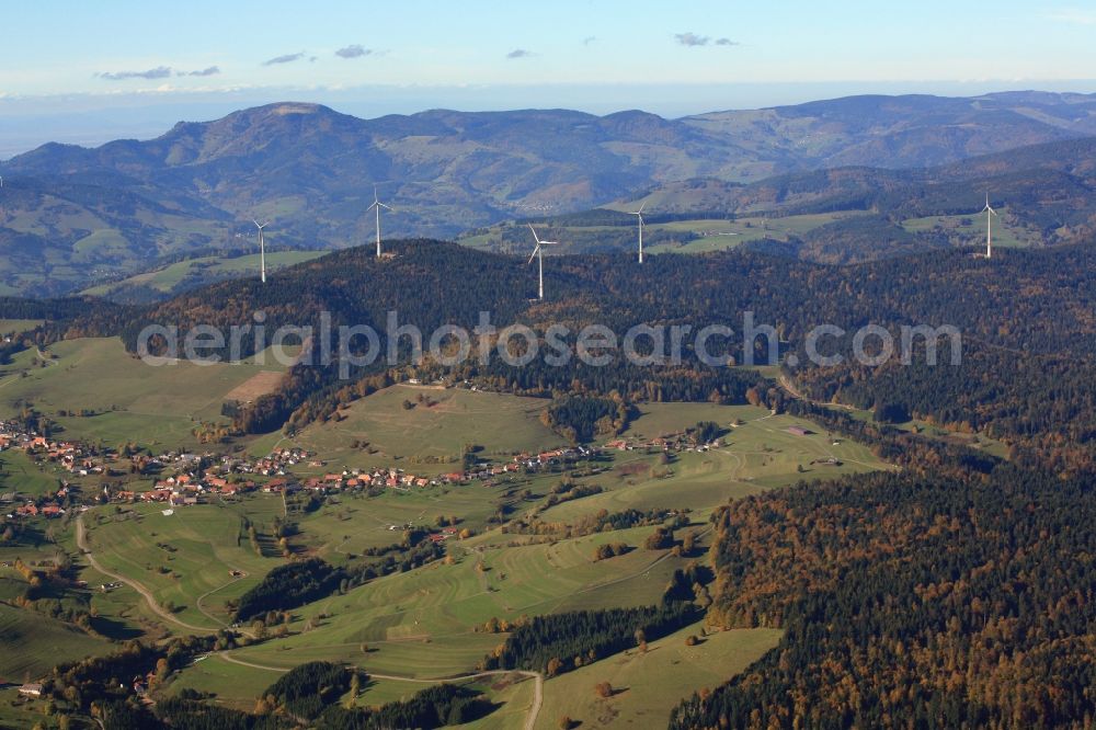 Schopfheim from the bird's eye view: On the Rohrenkopf, the local mountain of Gersbach, a district of Schopfheim in Baden-Wuerttemberg, wind turbines have started operation. It is the first wind farm in the south of the Black Forest. View from Gersbach to the mountain Belchen