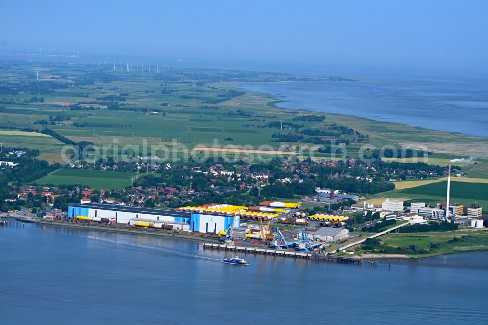 Nordenham from the bird's eye view: Storage and open areas of the wind turbine assembly and production facility Steelwind Nordenham on the banks of the Weser in Nordenham in the state Lower Saxony, Germany