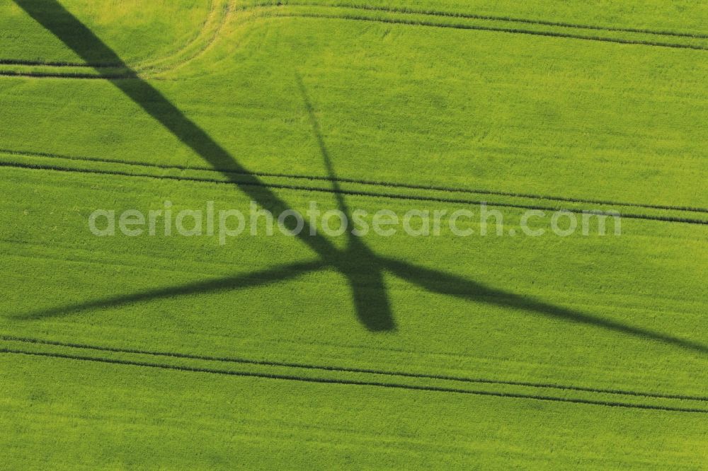 Greußen from above - Shadow of a wind turbine on a field with alleys in Greussen in the state of Thuringia