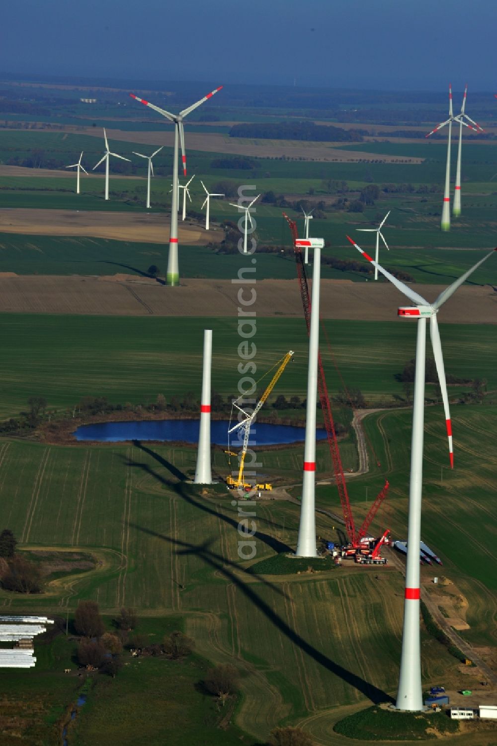 Prenzlau from above - Group of wind turbines of various types and sizes of company Senvion in Prenzlau in the state of Brandenburg