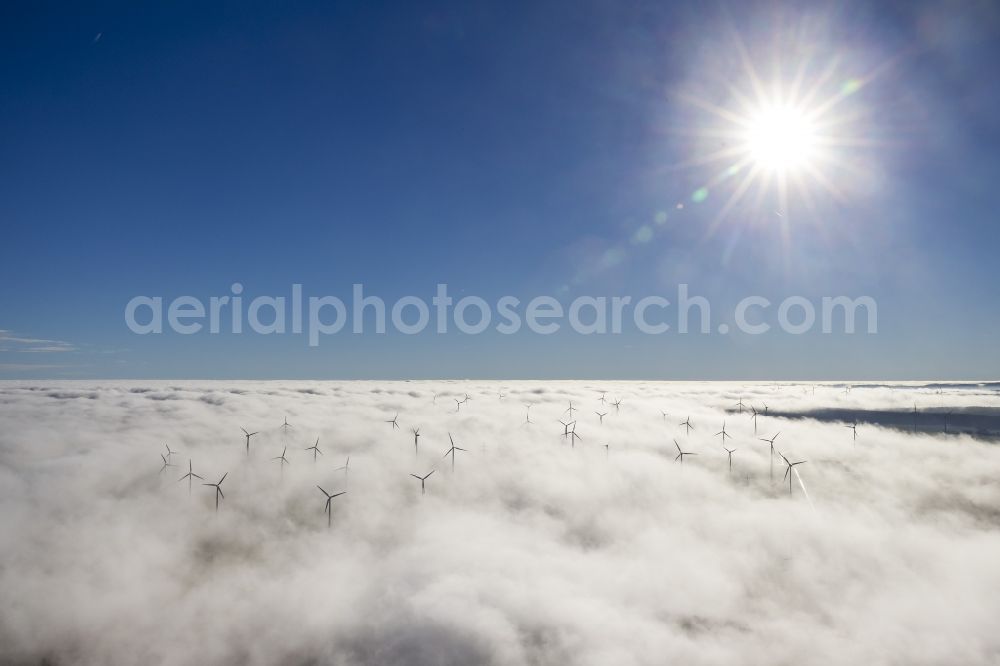 Aerial image Bad Wünnenberg - Wind turbines projecting from a fog layer and clouds Wind power plant at Bad Wünnenberg in the Sauerland region in North Rhine-Westphalia