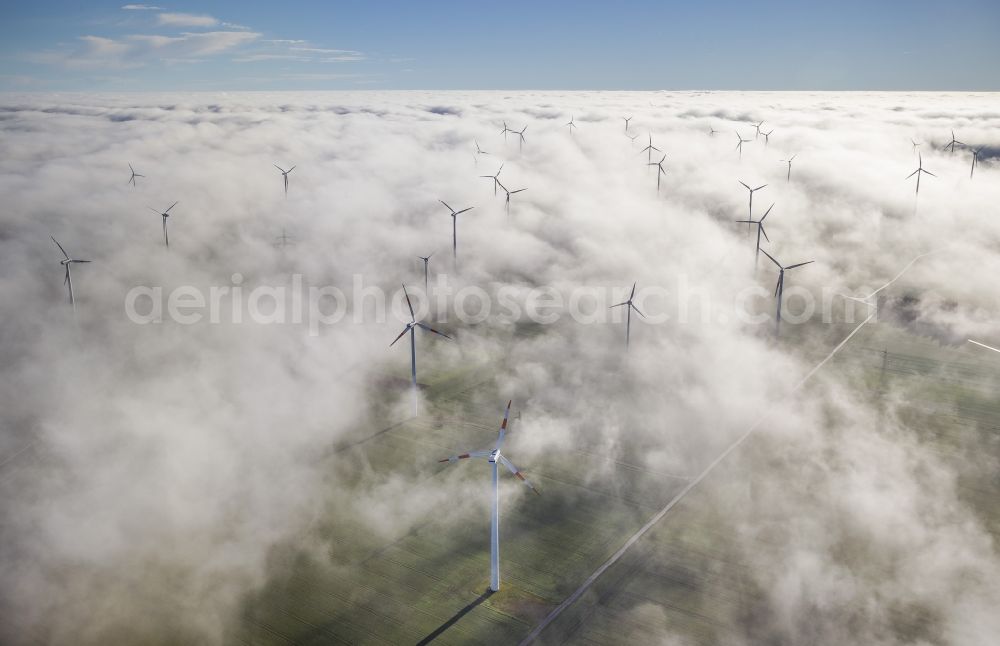 Bad Wünnenberg from the bird's eye view: Wind turbines projecting from a fog layer and clouds Wind power plant at Bad Wünnenberg in the Sauerland region in North Rhine-Westphalia