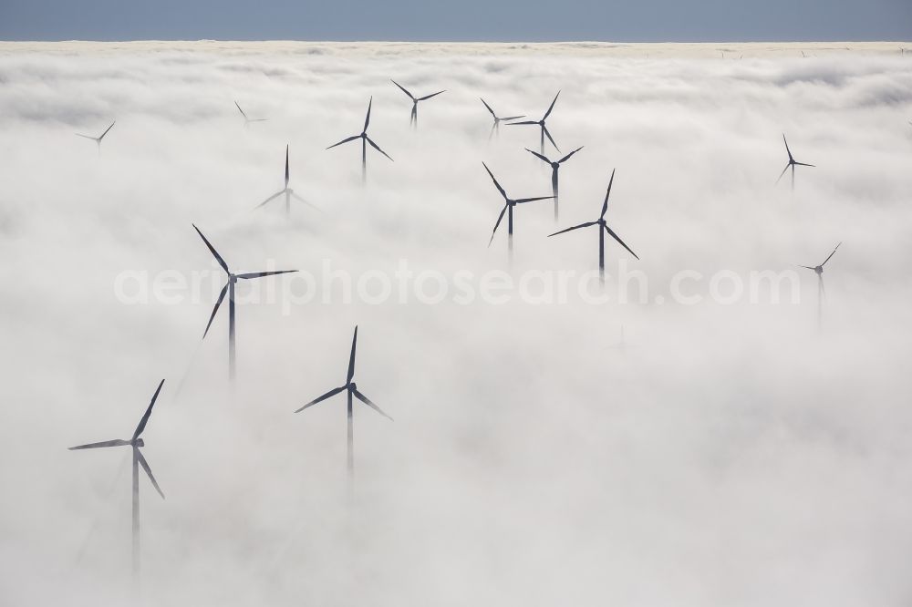 Marsberg from the bird's eye view: Wind turbines projecting from a fog layer and clouds Wind power plant at Marsberg in the Sauerland region in North Rhine-Westphalia