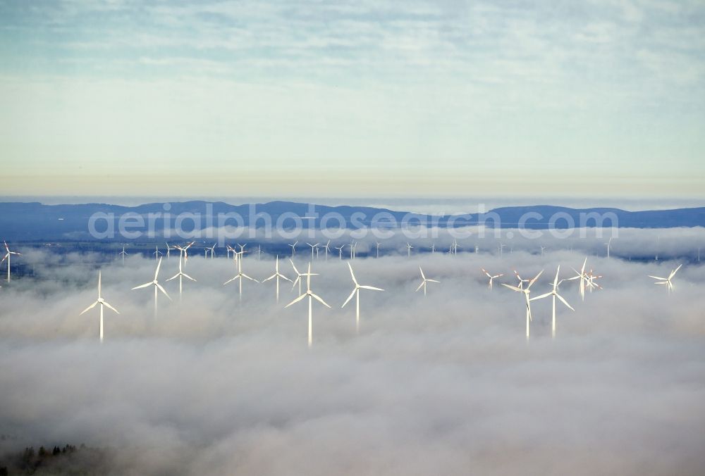 Marsberg from the bird's eye view: Wind turbines projecting from a fog layer and clouds Wind power plant at Marsberg in the Sauerland region in North Rhine-Westphalia