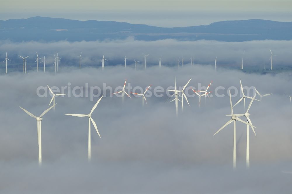 Marsberg from above - Wind turbines projecting from a fog layer and clouds Wind power plant at Marsberg in the Sauerland region in North Rhine-Westphalia