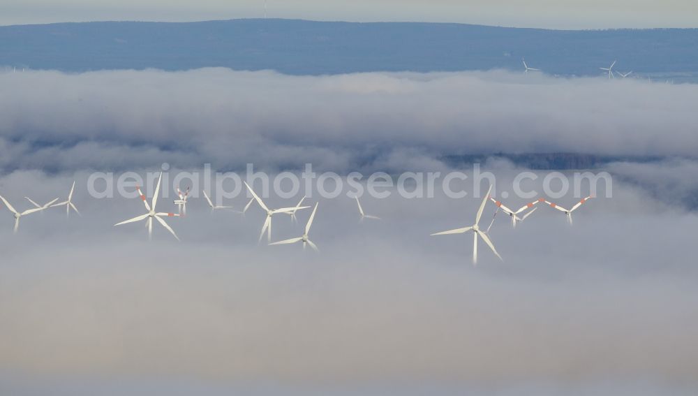 Marsberg from the bird's eye view: Wind turbines projecting from a fog layer and clouds Wind power plant at Marsberg in the Sauerland region in North Rhine-Westphalia