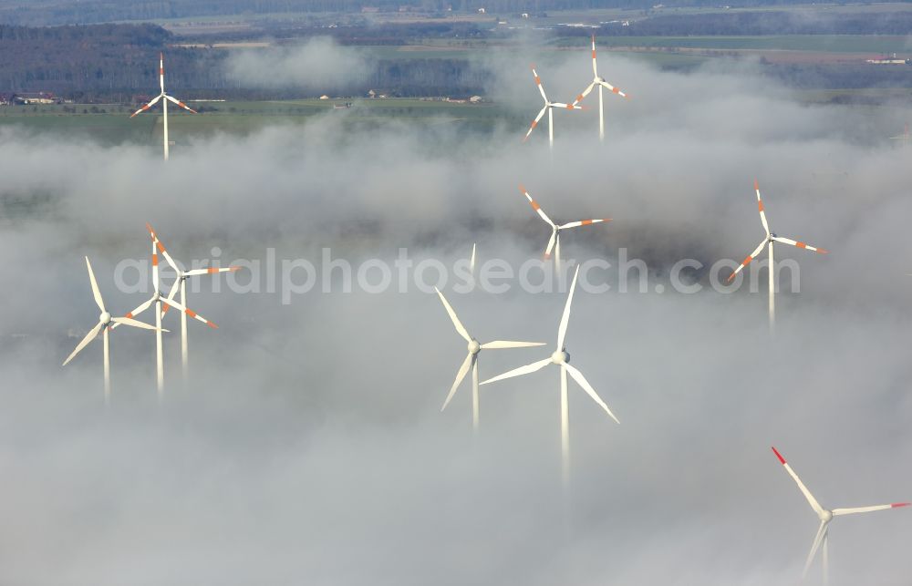 Aerial photograph Marsberg - Wind turbines projecting from a fog layer and clouds Wind power plant at Marsberg in the Sauerland region in North Rhine-Westphalia