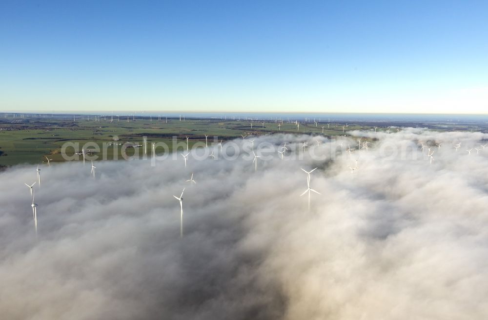 Marsberg from above - Wind turbines projecting from a fog layer and clouds Wind power plant at Marsberg in the Sauerland region in North Rhine-Westphalia