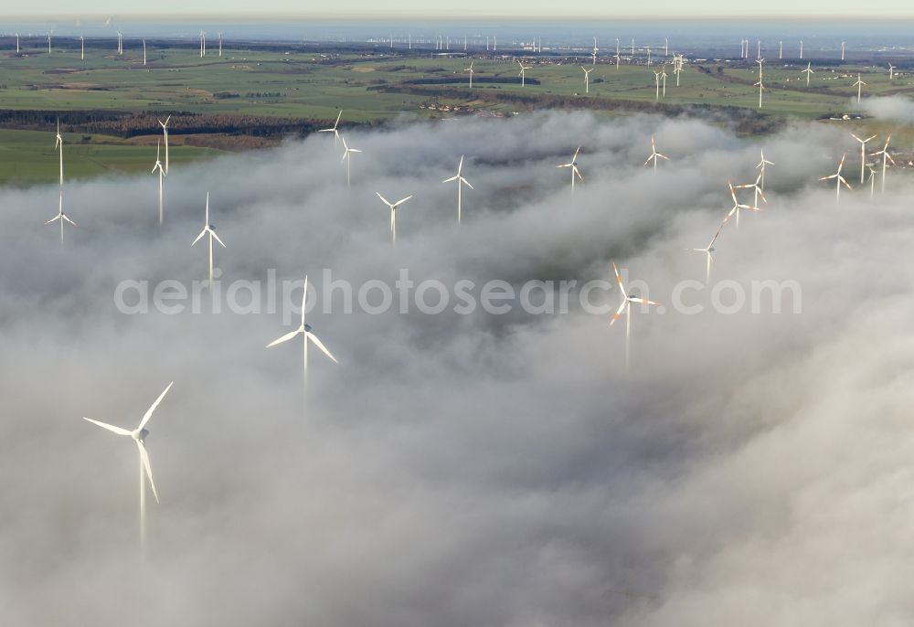 Marsberg from the bird's eye view: Wind turbines projecting from a fog layer and clouds Wind power plant at Marsberg in the Sauerland region in North Rhine-Westphalia