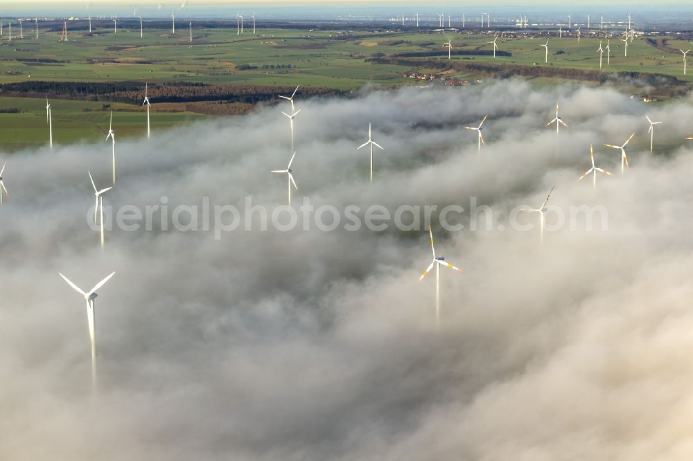 Aerial image Marsberg - Wind turbines projecting from a fog layer and clouds Wind power plant at Marsberg in the Sauerland region in North Rhine-Westphalia