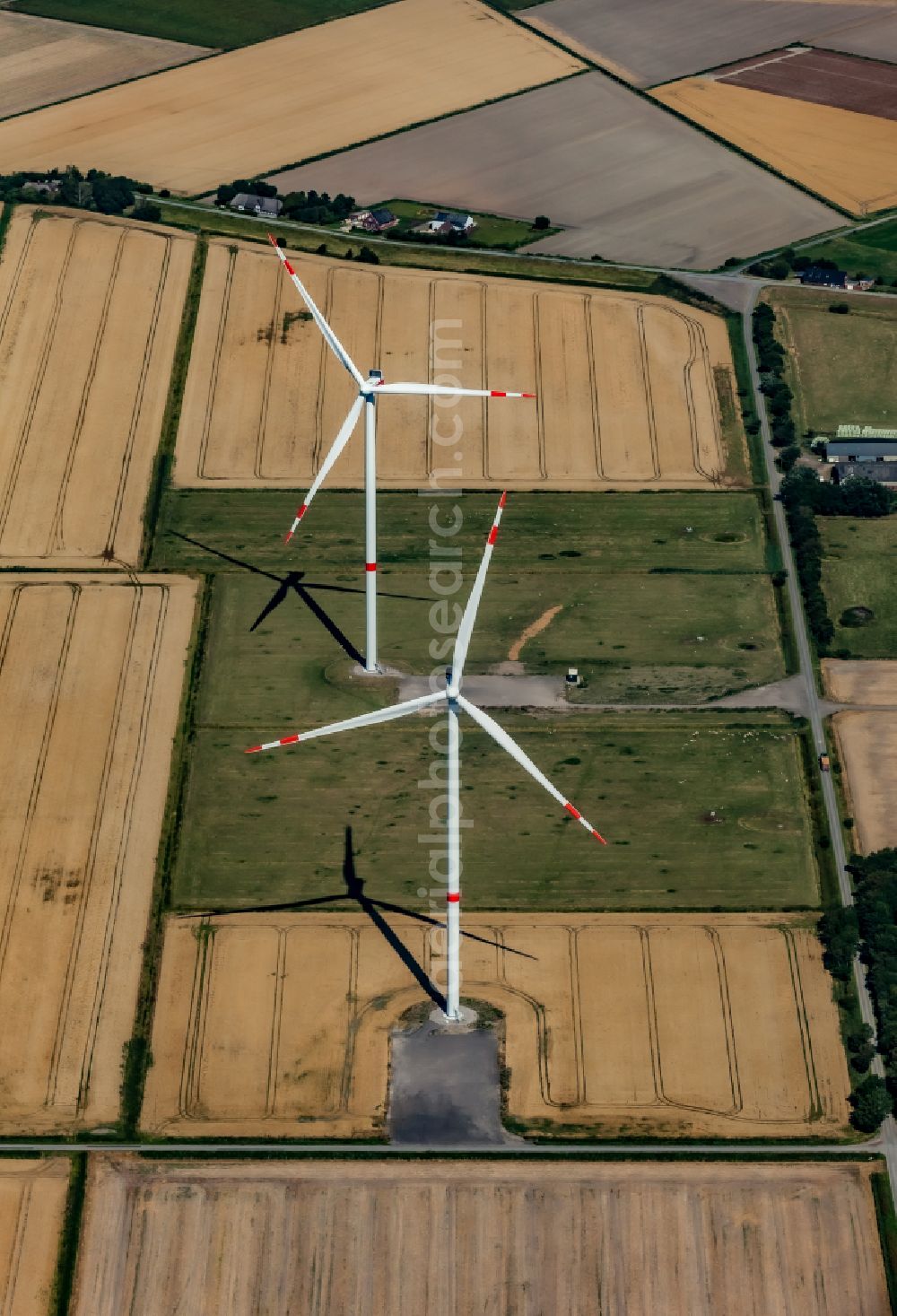 Aerial photograph Dagebüll - Wind turbines of a wind power plant on agricultural land and fields on the street Kreuzweg in Dagebuell North Friesland in the state Schleswig-Holstein, Germany