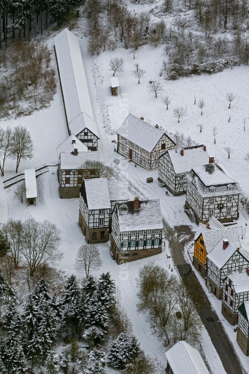 Hagen from above - Winter - landscape of snow-covered terrain of the open-air museum Hagen. The Westphalian State Museum of craft and technology is an open air museum in the Hagen district Selbecke Mäckingerbachtal in the southeastern Ruhr area in North Rhine-Westphalia. Carrier is the Regional Association of Westphalia-Lippe