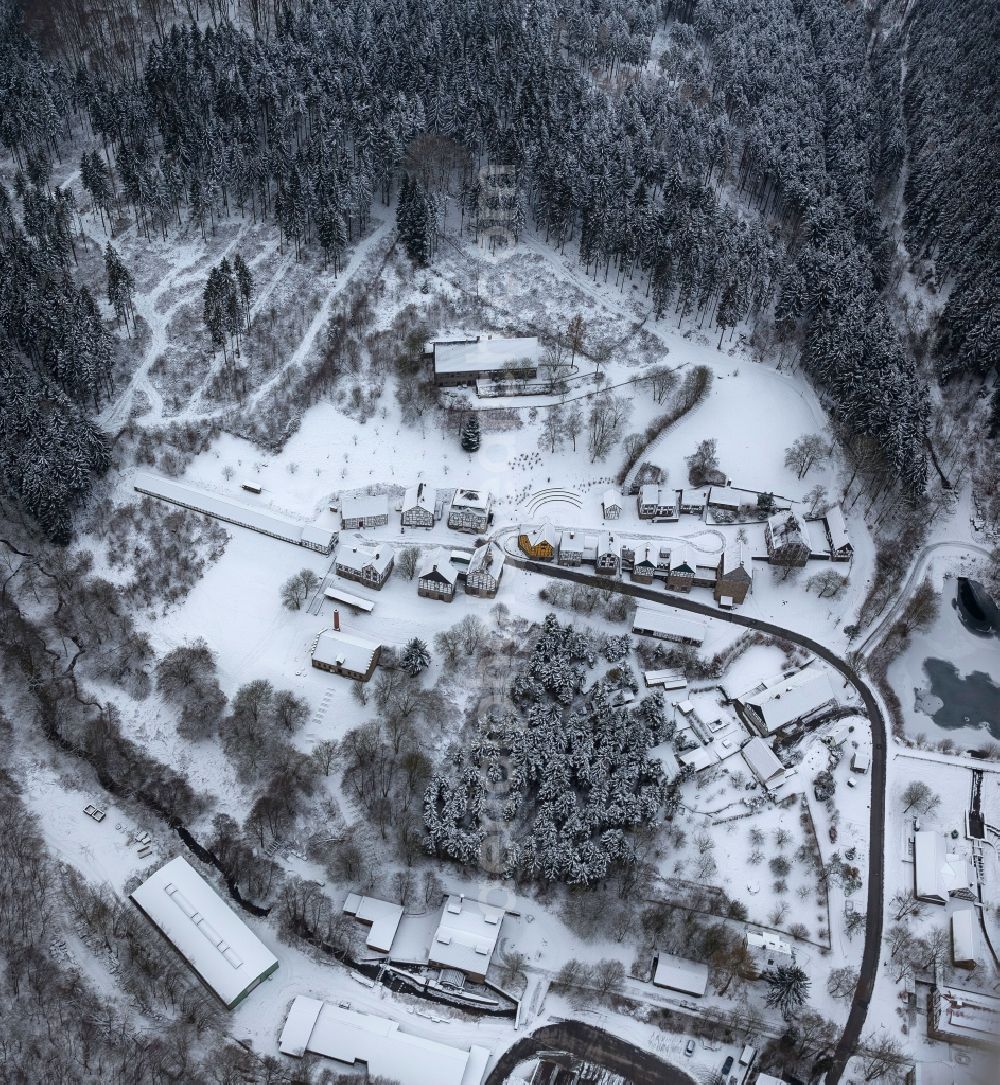 Hagen from the bird's eye view: Winter - landscape of snow-covered terrain of the open-air museum Hagen. The Westphalian State Museum of craft and technology is an open air museum in the Hagen district Selbecke Mäckingerbachtal in the southeastern Ruhr area in North Rhine-Westphalia. Carrier is the Regional Association of Westphalia-Lippe