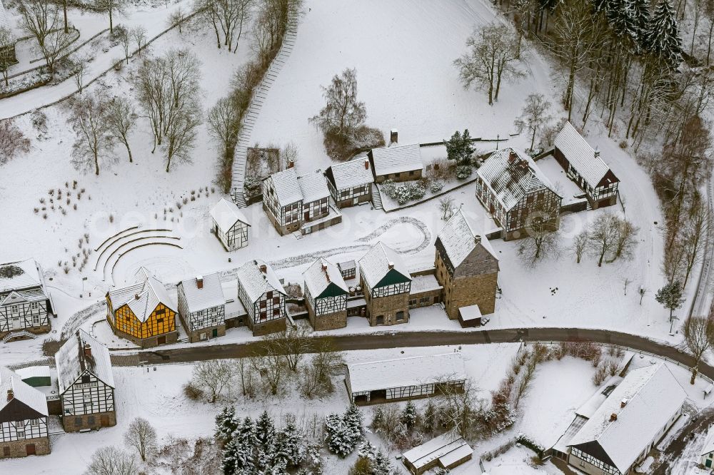 Hagen from the bird's eye view: Winter - landscape of snow-covered terrain of the open-air museum Hagen. The Westphalian State Museum of craft and technology is an open air museum in the Hagen district Selbecke Mäckingerbachtal in the southeastern Ruhr area in North Rhine-Westphalia. Carrier is the Regional Association of Westphalia-Lippe