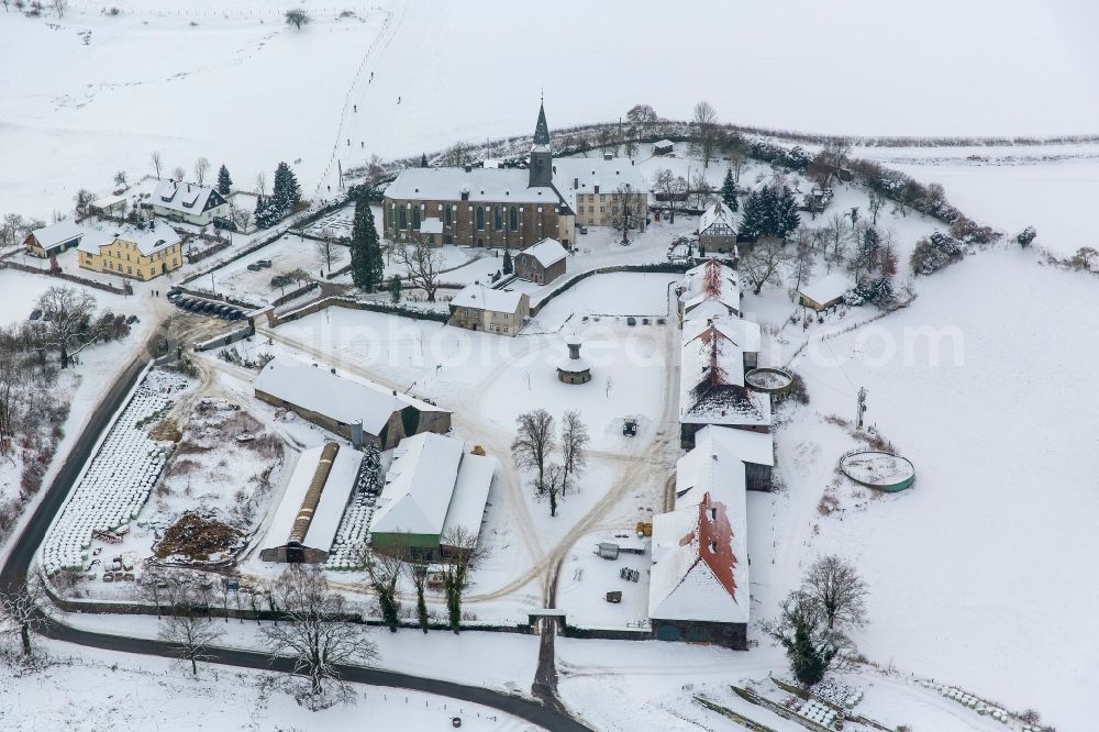 Arnsberg OT Holzen from the bird's eye view: Winter landscape of snow covered the monastery Oelinghausen in Arnsberg in North Rhine-Westphalia NRW