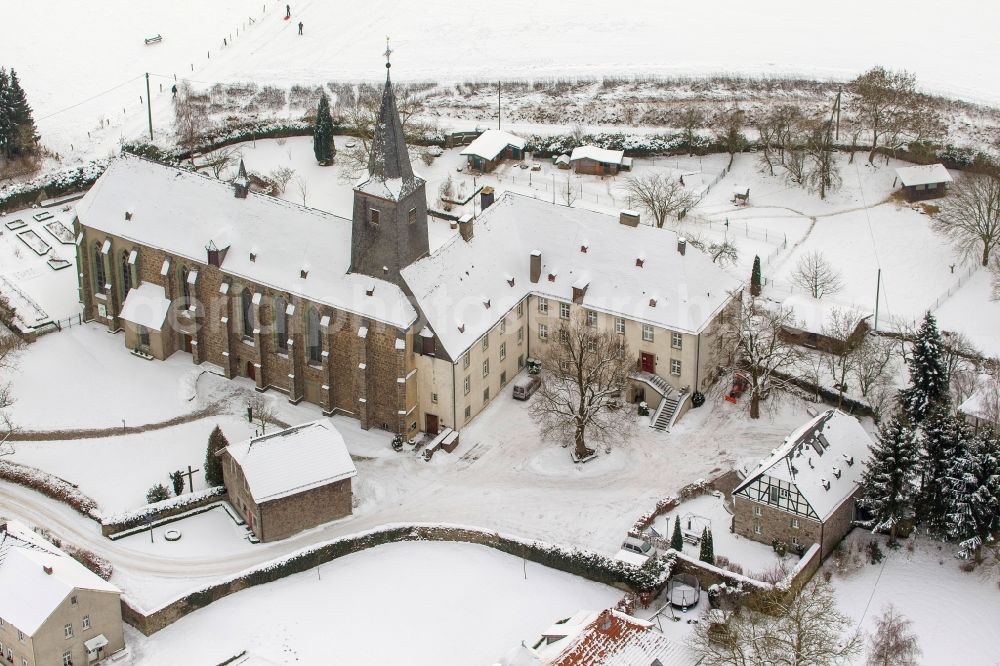 Aerial image Arnsberg OT Holzen - Winter landscape of snow covered the monastery Oelinghausen in Arnsberg in North Rhine-Westphalia NRW