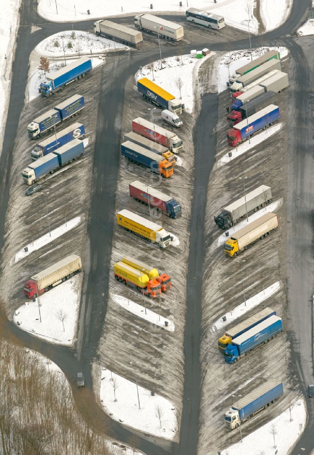 Hamm from above - Winter - landscape of snow-covered truck parking at the rest area Hamm, a welcome for driving periods - used breaks in freight resting place in Hamm in North Rhine-Westphalia