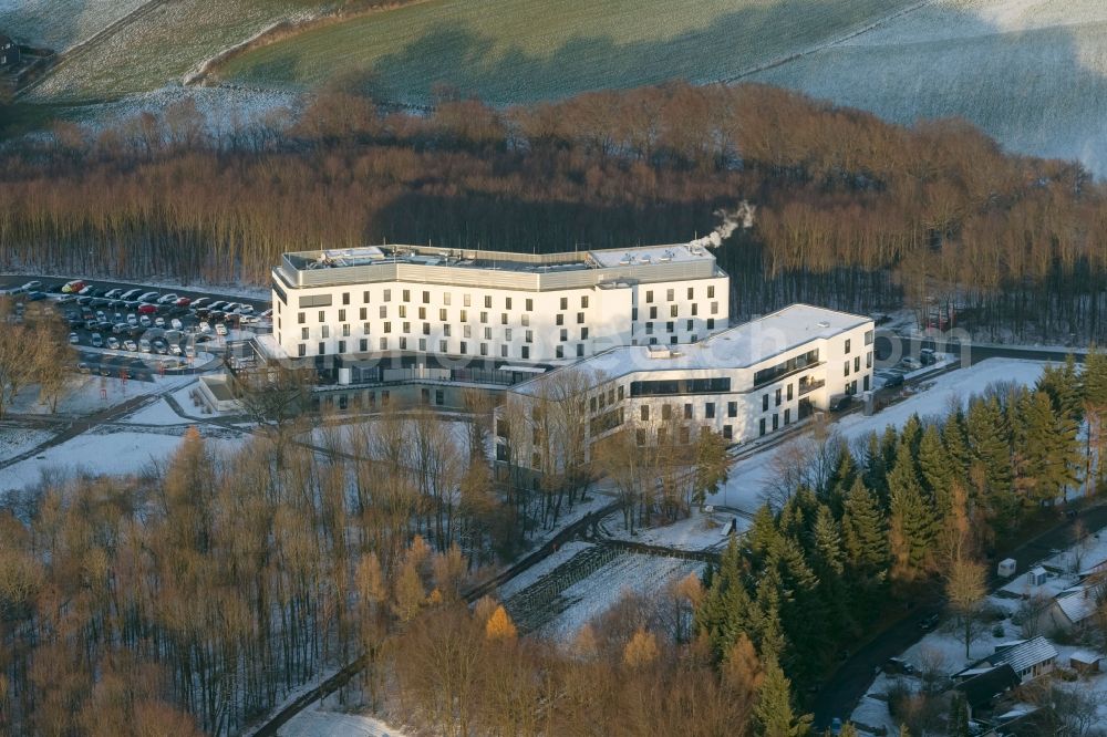 Sprockhoevel from the bird's eye view: Winter - snow landscape with building the training center of the IG Metall union in Sprockhoevel in North Rhine-Westphalia