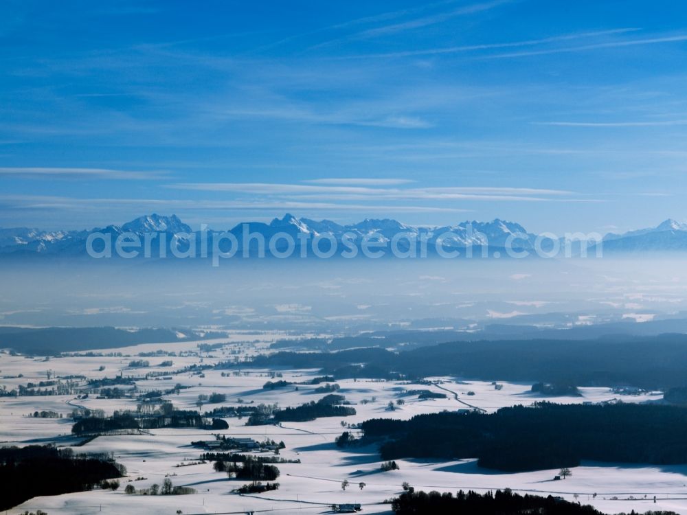 Aerial photograph Inzell - Winter - Landscape with snowy fields of the Chiemgau before the panorama of the Alps - mountains on the horizon at Inzell in Bavaria