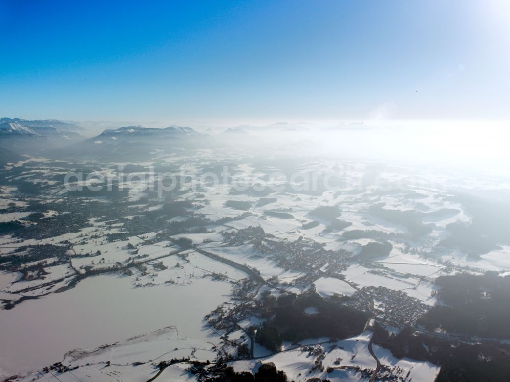 Aerial image Inzell - Winter - Landscape with snowy fields of the Chiemgau before the panorama of the Alps - mountains on the horizon at Inzell in Bavaria