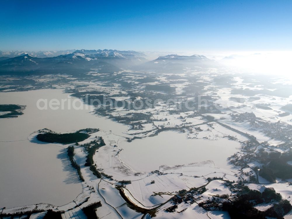 Aerial photograph Inzell - Winter - Landscape with snowy fields of the Chiemgau before the panorama of the Alps - mountains on the horizon at Inzell in Bavaria