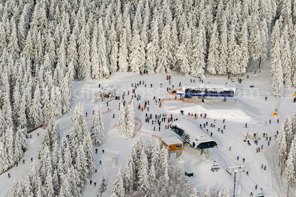 Aerial image Winterberg - Winter landscape of snowy mountain station of the ski lift in the Winterberg in Winterberg Büre in North Rhine-Westphalia NRW