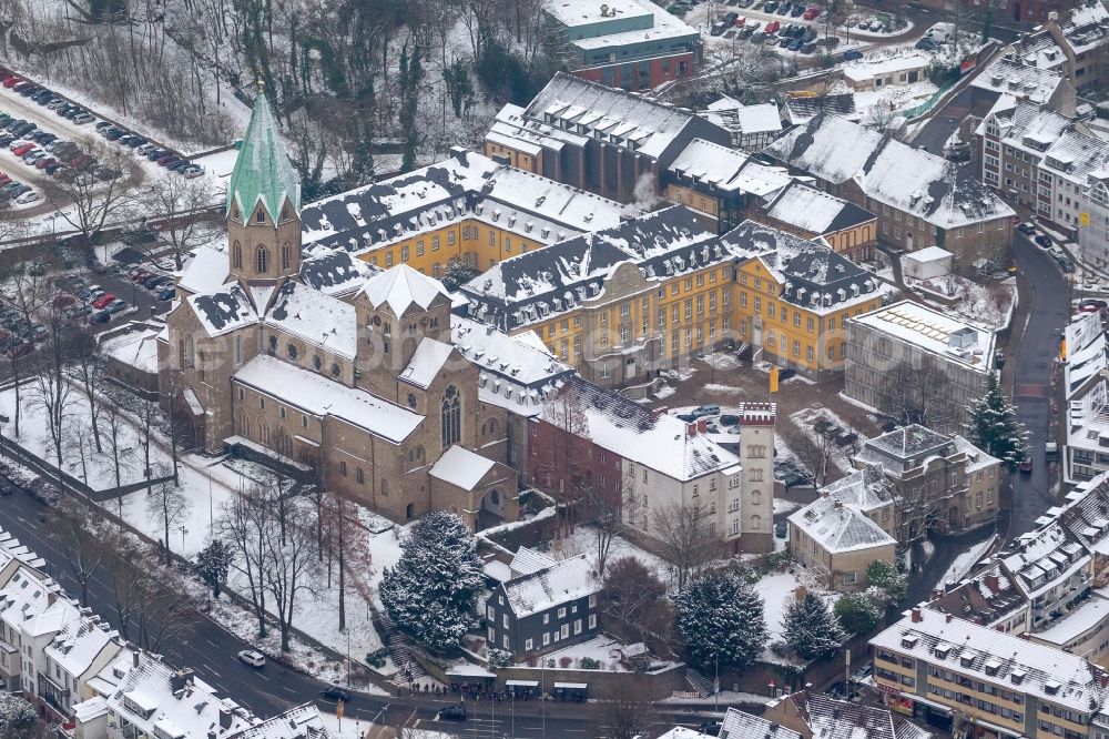 Essen from above - Snow covered Folkwang University and Abbey Church of the Basilica of St. Ludger in Essen in North Rhine-Westphalia NRW