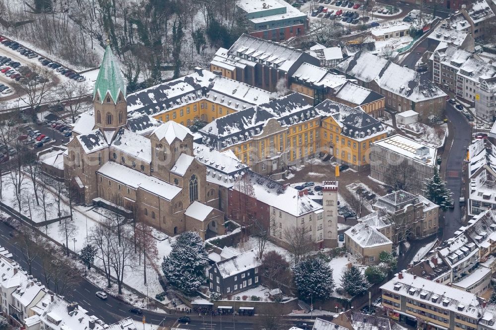 Essen from the bird's eye view: Snow covered Folkwang University and Abbey Church of the Basilica of St. Ludger in Essen in North Rhine-Westphalia NRW