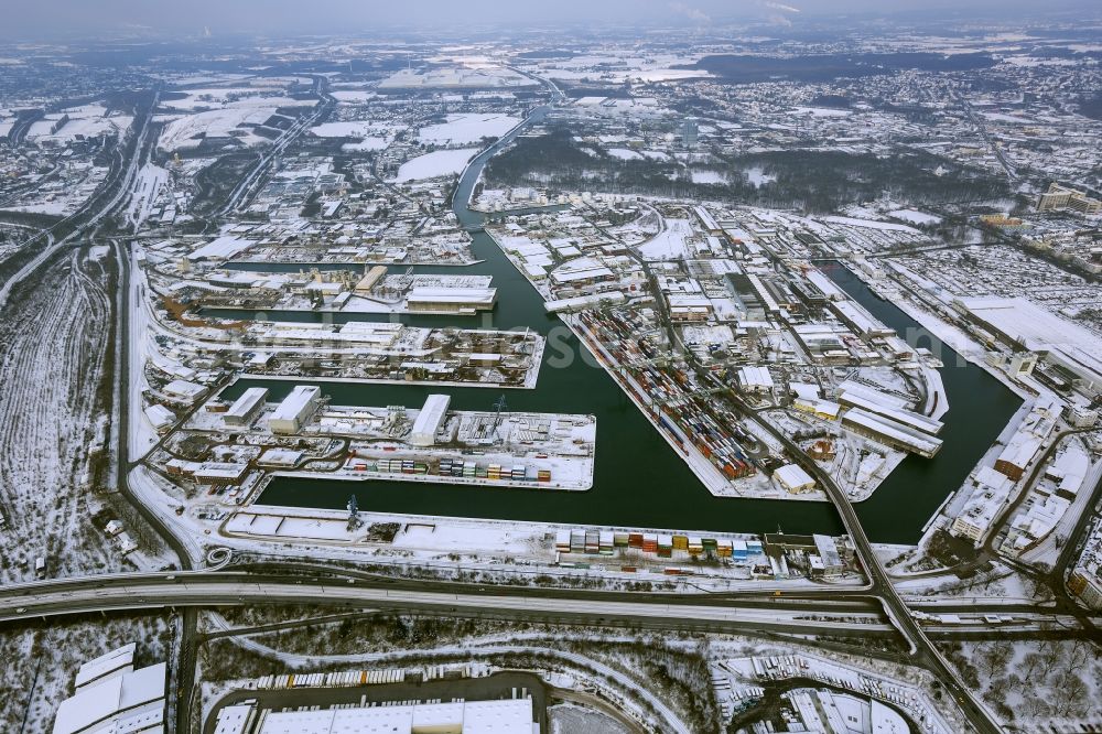 Aerial photograph Dortmund - Winter - Aerial view of snow-covered terrain of the inland port to the seat of the disposal company Envio in Dortmund in North Rhine-Westphalia. In the largest toxic waste scandal in the country to the recycling company Envio have poisoned over the years employees and residents in Dortmund with carcinogenic PCBs