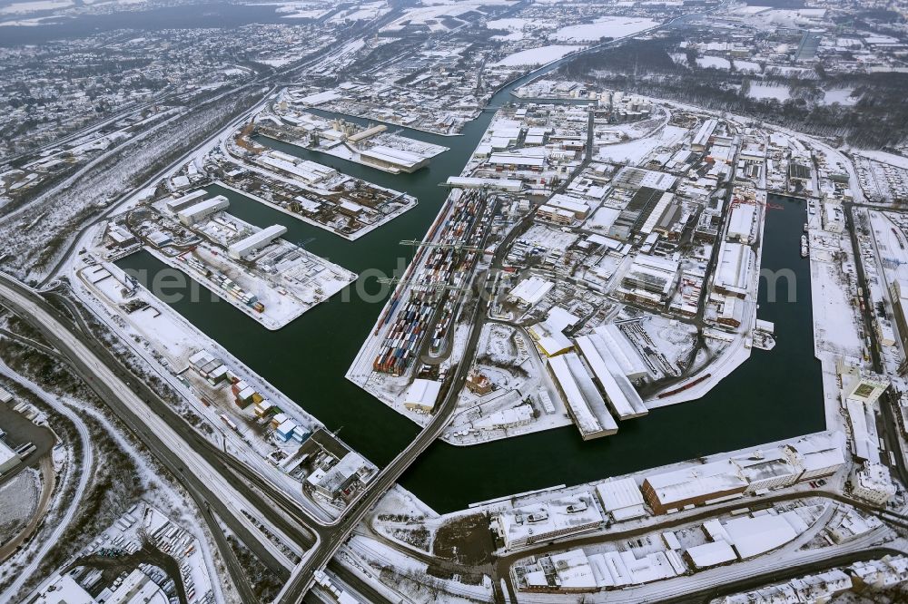 Dortmund from above - Winter - Aerial view of snow-covered terrain of the inland port to the seat of the disposal company Envio in Dortmund in North Rhine-Westphalia. In the largest toxic waste scandal in the country to the recycling company Envio have poisoned over the years employees and residents in Dortmund with carcinogenic PCBs