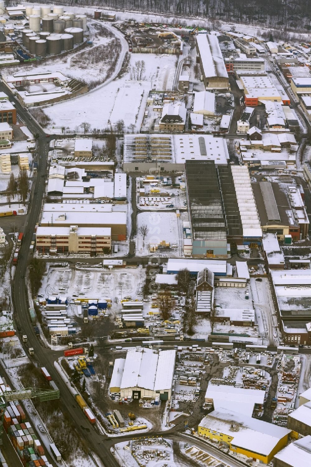 Dortmund from above - Winter - Aerial view of snow-covered terrain of the inland port to the seat of the disposal company Envio in Dortmund in North Rhine-Westphalia. In the largest toxic waste scandal in the country to the recycling company Envio have poisoned over the years employees and residents in Dortmund with carcinogenic PCBs