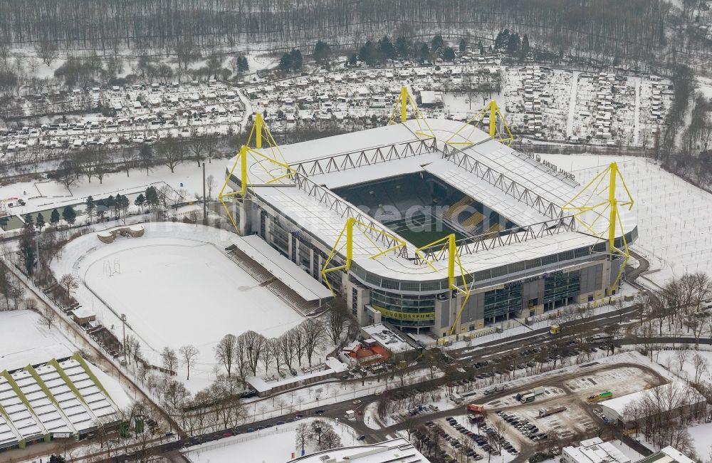 Dortmund from the bird's eye view: Winter - Aerial view of snow-covered terrain of Borusseum, the Signal Iduna Park stadium in Dortmund BVB in North Rhine-Westphalia